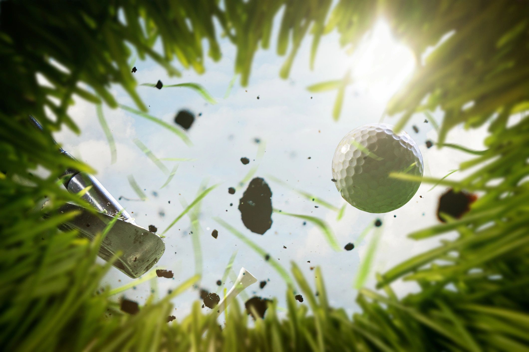 Golf ball in flight under a blue sky, symbolizing measurable ball flight and performance