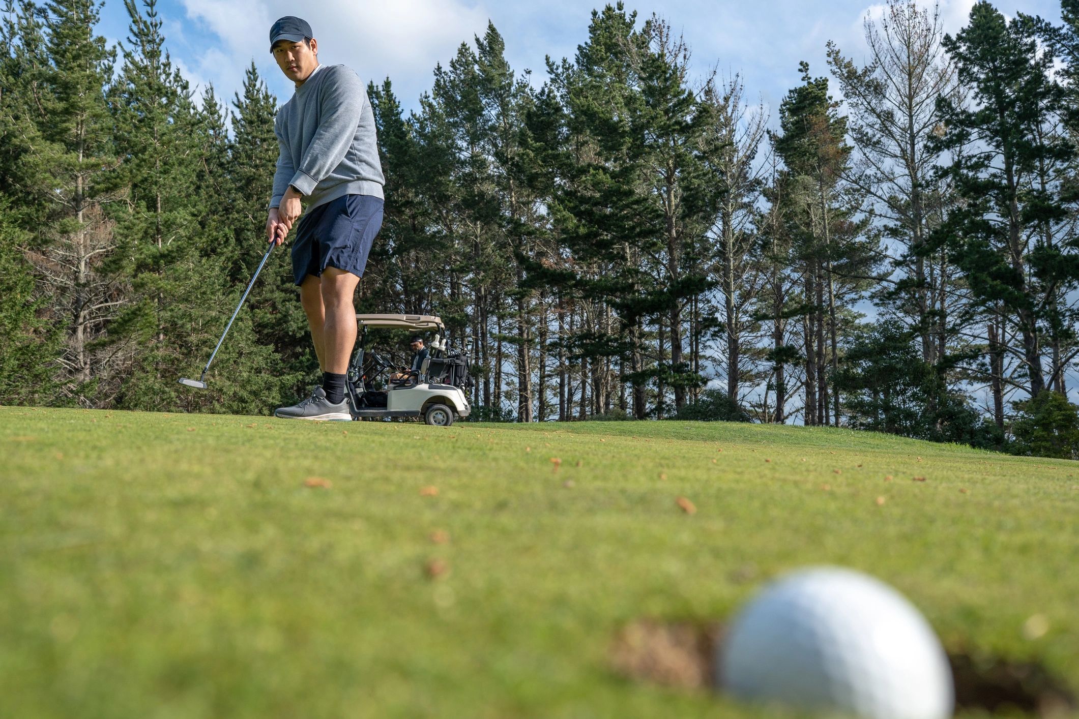 Golfer on course in daylight